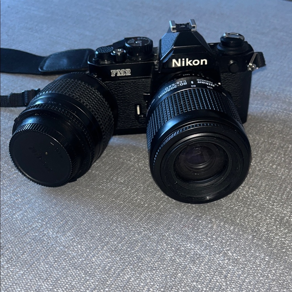 Nikon FM2 Film SLR Camera in Black with Two Black Lenses